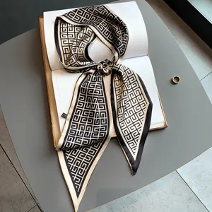 Elegant black and white geometric skinny silk scarf, versatile twilly for hair or neck.