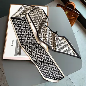 Chic black and white geometric silk feel twilly scarf, perfect for stylish neck wear.