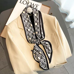 Chic black and white patterned silk-feel twilly scarf with elegant carriage motif for women.