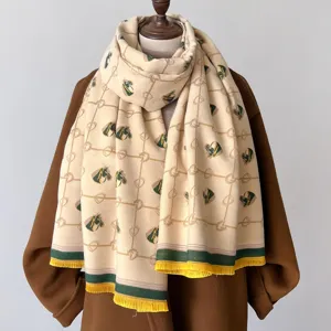 Chic cashmere-feel winter scarf with classic equestrian horse head and geometric print design.