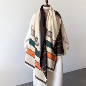 Detailed view of the winter long wool-feel scarf with elegant belt buckle print design.