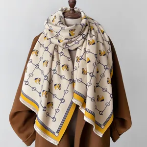 Detail shot of thickened imitation cashmere shawl scarf with classic horse head geometric pattern.
