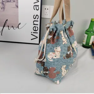 Canvas tote bag with cute cat print, drawstring closure and sturdy handles for daily use.