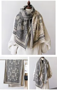 Close up detail view of winter cashmere feel paisley print color block scarf and warm shawl.