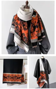 Close-up of winter cashmere-feel shawl scarf, orange black paisley pattern fringe detail.