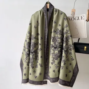 Detailed view of women's autumn winter green cashmere feel reversible butterfly print scarf