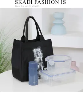 Black canvas lunch bag and tote for women, stylish large capacity commuter handbag and storage.