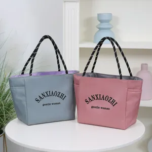 Durable waterproof nylon tote bag for women, stylish daily commute shoulder bag.