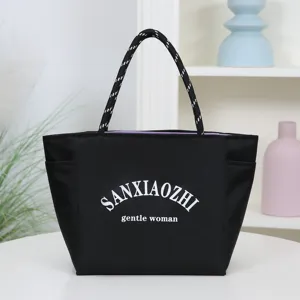 Black waterproof tote bag for women, large capacity casual commuting handbag with rope handles.