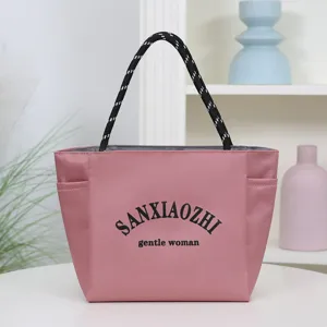 Pink waterproof tote bag, large capacity shoulder bag with rope handles for daily commuting.