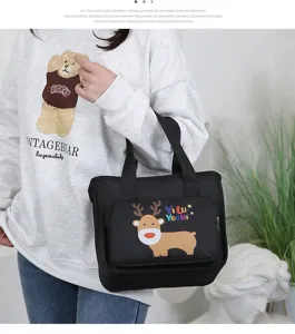 Insulated lunch bag black tote with cute cartoon deer print, thermal bento box for daily use.
