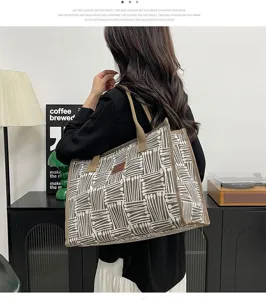 Casual canvas tote bag with geometric print, stylish shoulder bag for daily commute and travel.
