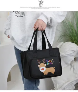 Insulated lunch bag detail featuring a cute cartoon reindeer print, large capacity and thick design.