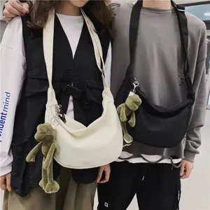 Minimalist canvas messenger bag with cute frog pendant, casual large capacity daily crossbody.