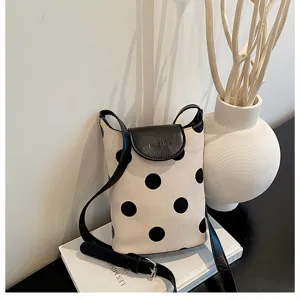 Canvas polka dot crossbody shoulder bag detail, linen spliced bucket bag with black leather flap.