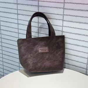 Close-up of the dark brown PU leather tote, showing sturdy handle and large capacity.