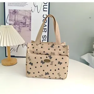 Canvas handbag with cute bow and heart print, stylish commuter tote bag for daily lunch or work.