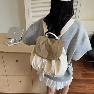 Korean style lightweight nylon backpack with contrast color splicing and large capacity.