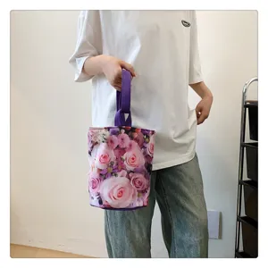 Small canvas bucket handbag with beautiful pink rose floral print, lightweight and portable.