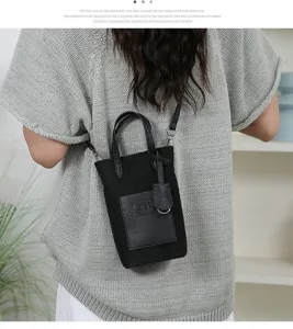 Mini black crossbody phone bag, fashionable women bucket shoulder bag for daily travel use.
