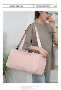 Pink travel duffel bag for women, large capacity gym bag with shoulder strap and wet dry separation.
