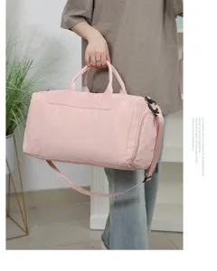 Lightweight pink waterproof travel duffel bag large capacity gym bag with shoulder straps.