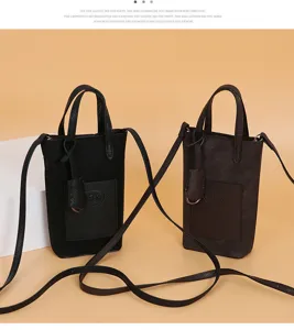 Detail view of mini crossbody phone bag, trendy leather shoulder bag with handle.