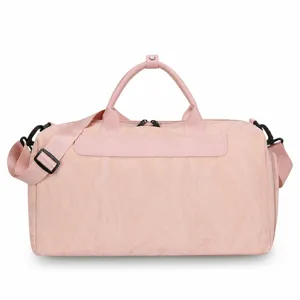 Pink waterproof PU travel duffel bag with large capacity and wet dry separation for fitness.