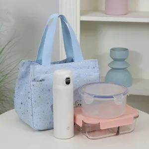 Stylish star print lunch bag with durable canvas material, large capacity tote handbag for daily commuting.