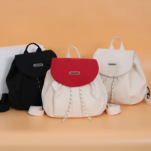 Casual canvas backpack for women, stylish color-blocking school bookbag with drawstring.