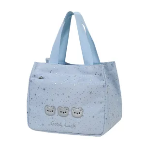 Light blue canvas tote bag with star prints and cute bear embroidery for daily commuting.