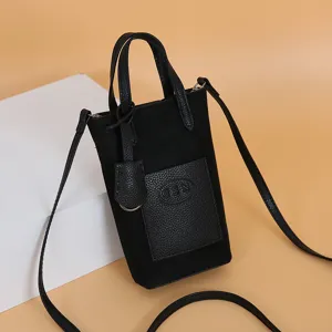 Black mini crossbody phone bag for women, stylish small bucket bag with top handle and strap.