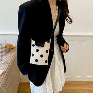 Canvas polka dot crossbody shoulder bag with black leather flap and strap for women