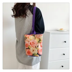 Canvas floral bucket bag detail view, lightweight portable shoulder handbag for daily use.