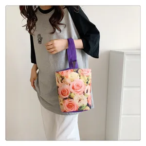 Stylish canvas bucket bag with floral print, portable handbag for daily use and lunch.