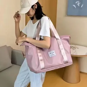 Large capacity pink travel duffel bag for women, waterproof gym luggage tote with stylish handles.