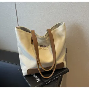 Canvas tote bag casual shoulder bag minimalist daily commuting handbag with contrast leather trim.