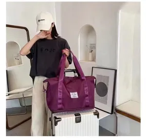 Large capacity purple travel duffel bag, waterproof nylon sports fitness shoulder bag for women.