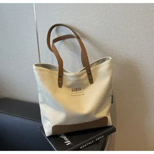 Canvas tote bag for women daily casual commute shoulder handbag with contrast brown leather handles.