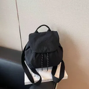 Casual black nylon backpack with drawstring closure and comfortable shoulder straps for daily use.