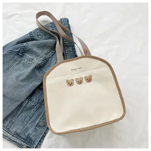 Cute canvas tote bag with embroidered cute bears and stylish brown trim for daily use.