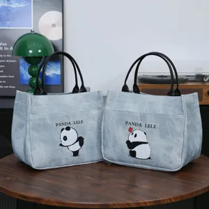 Stylish light blue PU leather handbag and lunch tote bag featuring cute cartoon panda print.