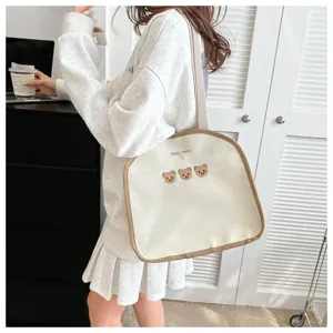 Casual canvas tote bag with cute bear embroidery and brown trim for daily casual commuting.