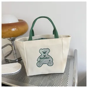 Canvas tote bag with green handles and cute bear embroidery, casual daily handbag for women.