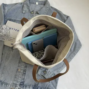 Minimalist canvas tote bag for women, large capacity casual shoulder handbag with inner pocket.