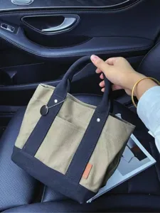 Detailed view of Japanese canvas tote bag showcasing front pocket and sturdy handle design.