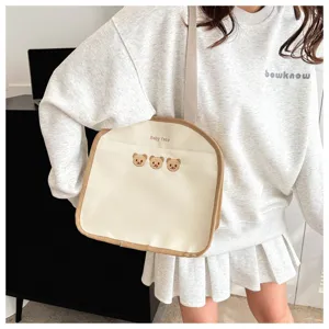 Casual canvas shoulder bag with cute bear embroidery, lightweight daily crossbody tote for women.