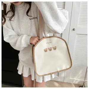 Korean INS style canvas lunch bag with cute bear embroidery and brown trim detail.