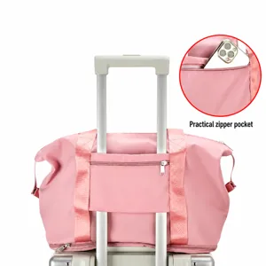 Pink travel duffel bag for women, large capacity weekender bag with luggage sleeve and pocket.