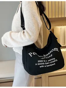 Casual black canvas shoulder tote bag for women, large capacity daily commuting bag.